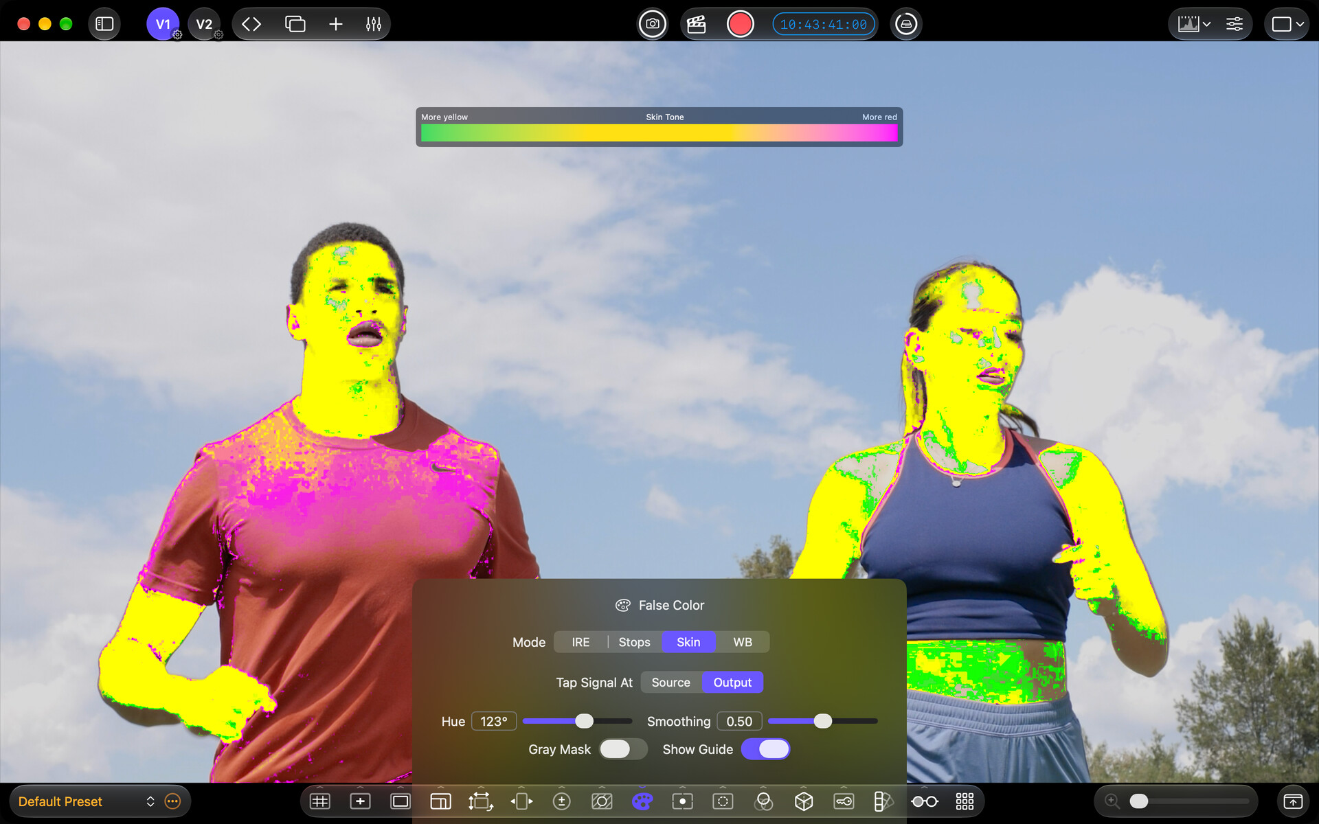 False Color Skin mode highlighting skin tones on two runners, with controls and color key visible