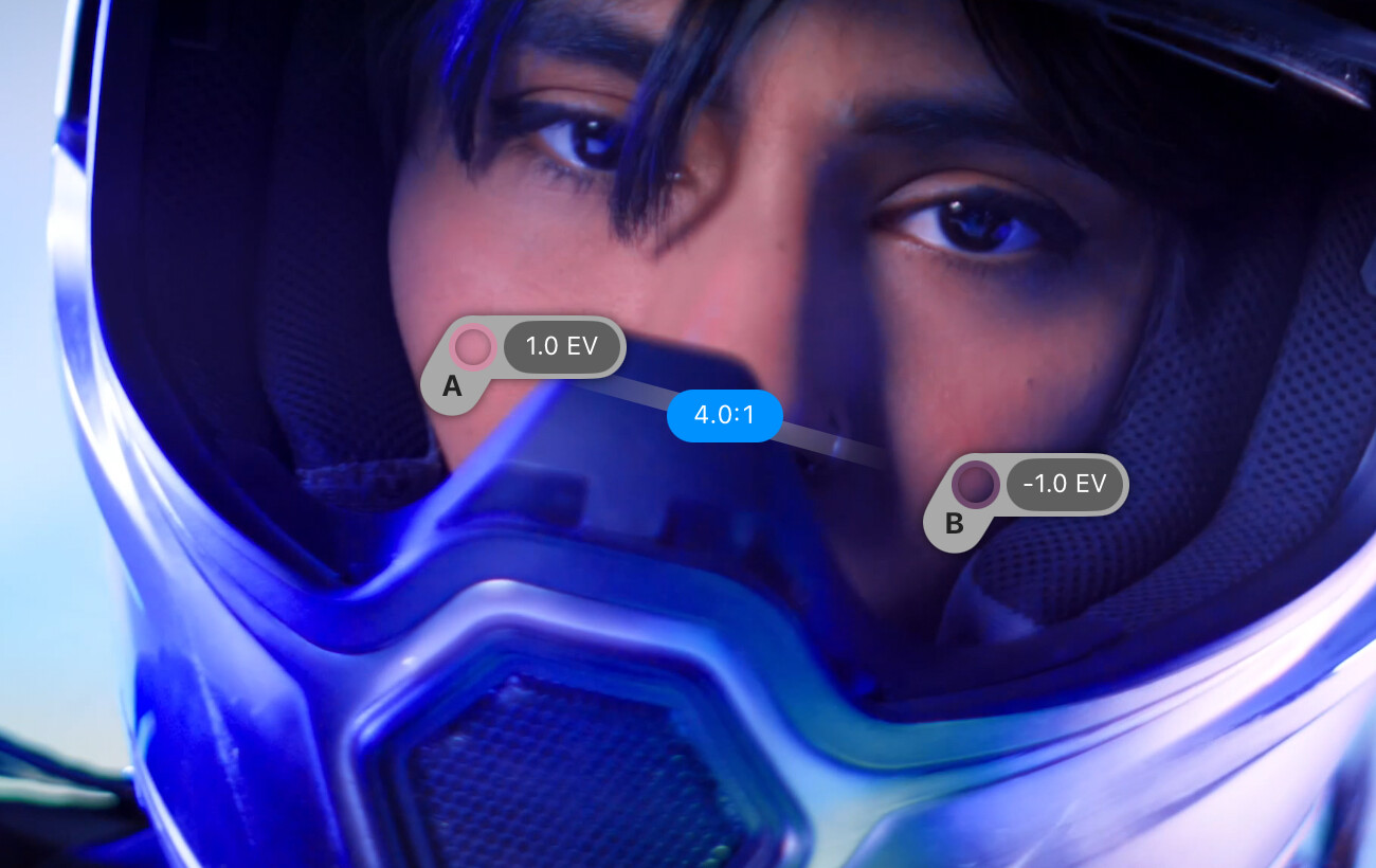 Spot Meter probes on a face reading +1 EV and −1 EV with a 4:1 contrast ratio